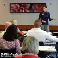 Dr. Carrie Brubaker speaking to a conference audience